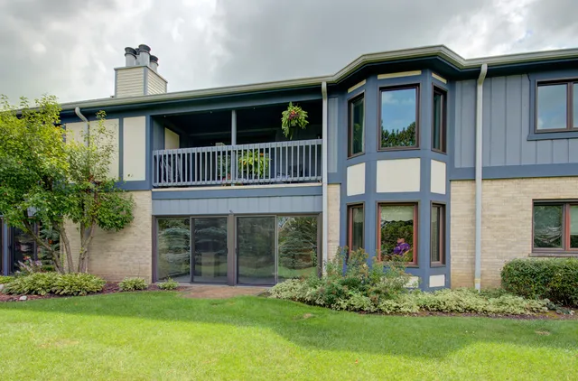 a front view of a house with a yard and porch