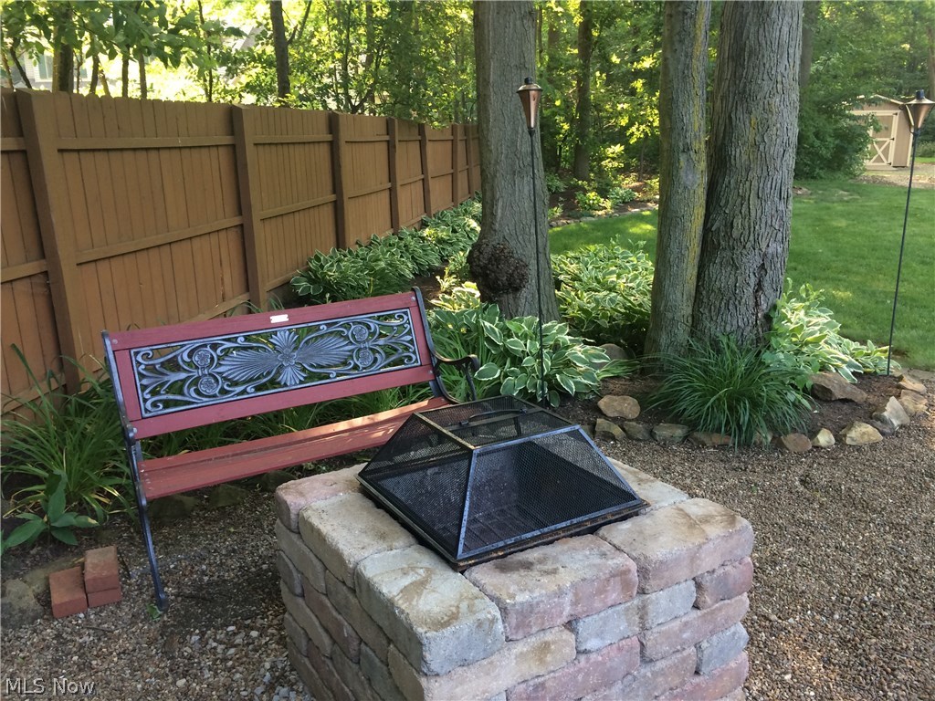 6739 Stoney Ridge Road North Ridgeville, OH 44039 - Photo 15 of 32 Custom stone fire pit area for roasting the marshmallows.