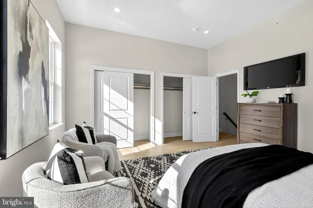 a bedroom with a bed and furniture