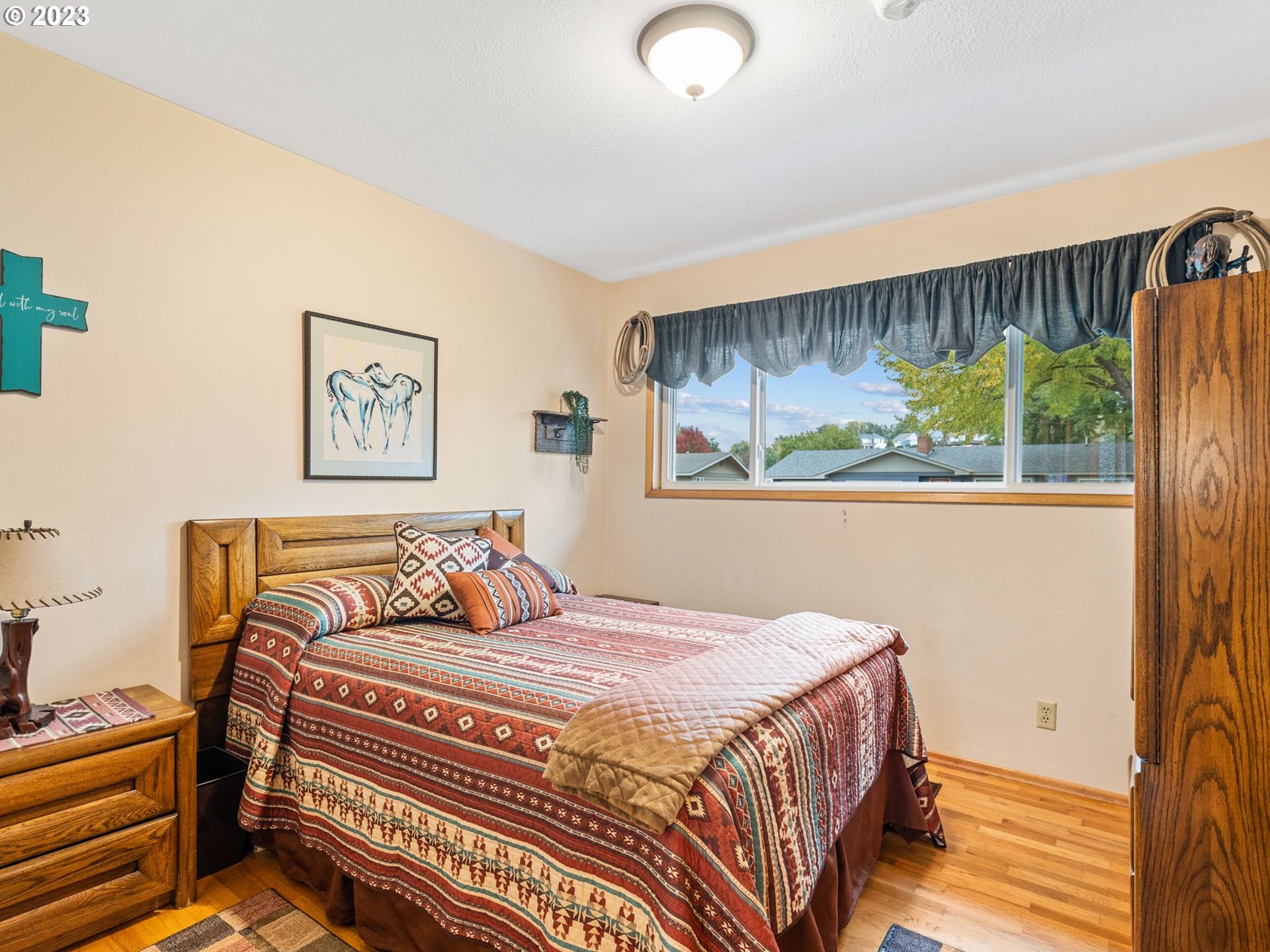 1341 Southwest 40th Street Pendleton, OR 97801 - Photo 23 of 35 a bedroom with a large bed and a window