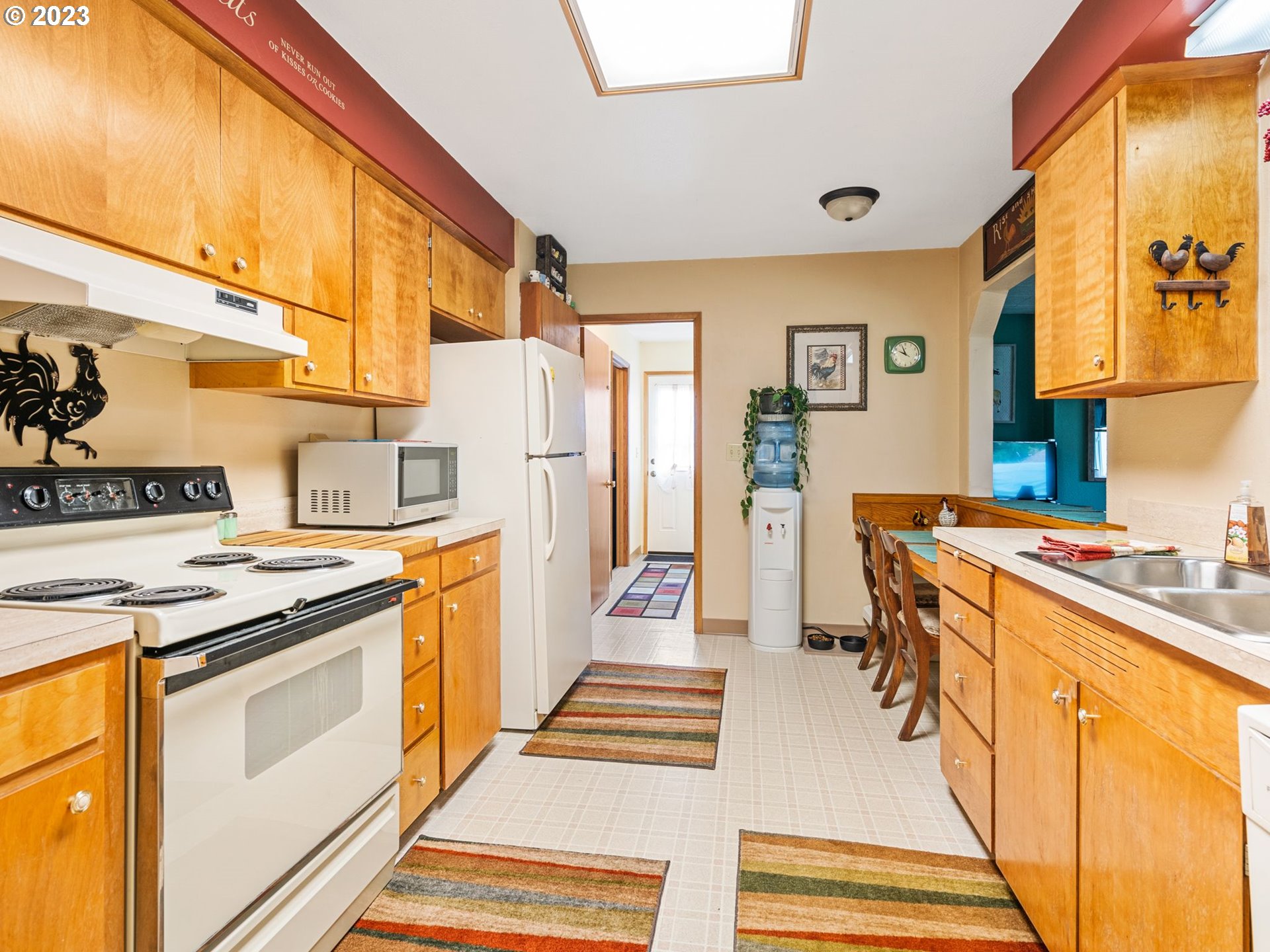 1341 Southwest 40th Street Pendleton, OR 97801 - Photo 29 of 35 a kitchen with stainless steel appliances a stove and a refrigerator