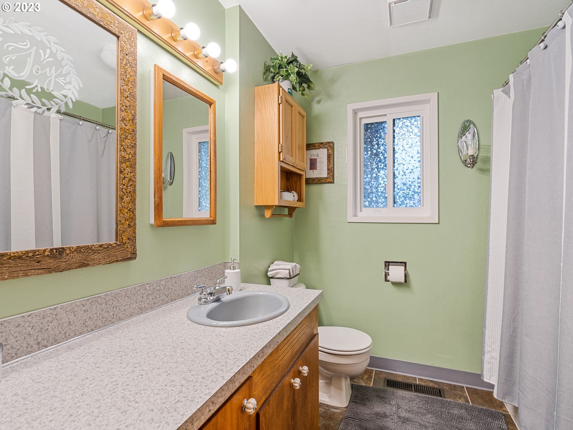 1341 Southwest 40th Street Pendleton, OR 97801 - Photo 31 of 35 a bathroom with a granite countertop sink toilet and shower