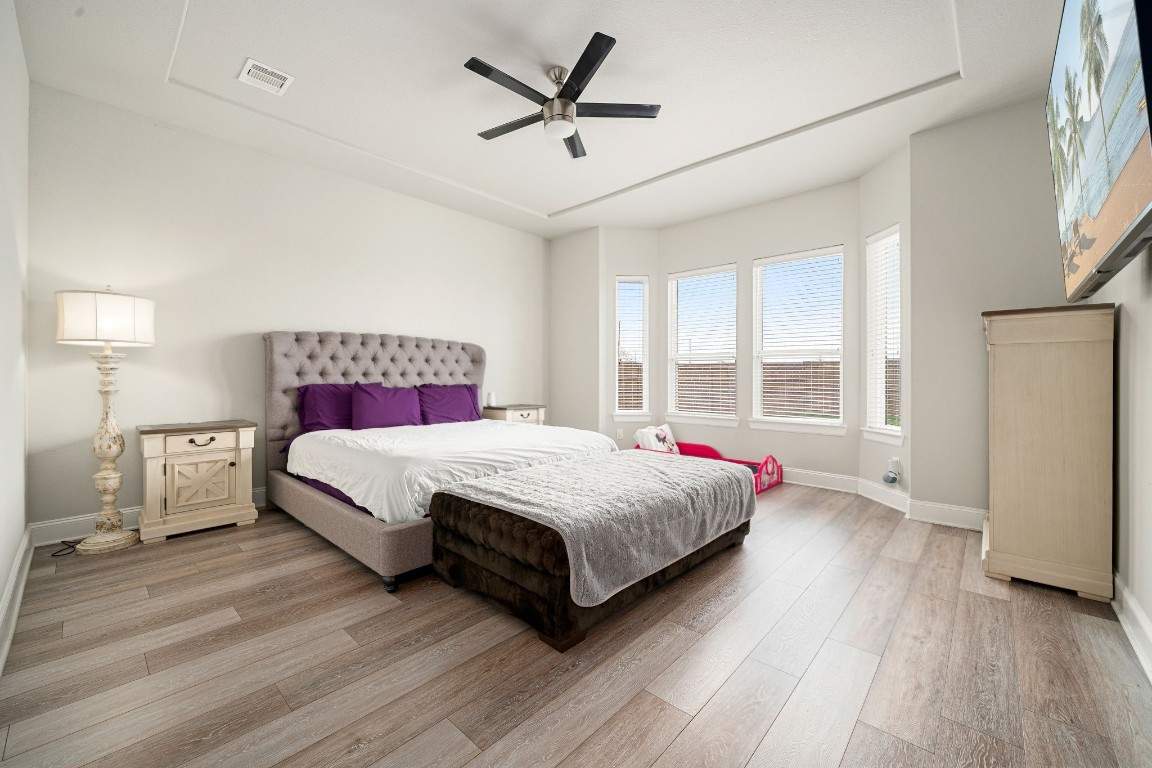 6203 Silver Lk Lane Manvel, TX 77578 - Photo 16 of 50 a bed room with a bed and a ceiling fan