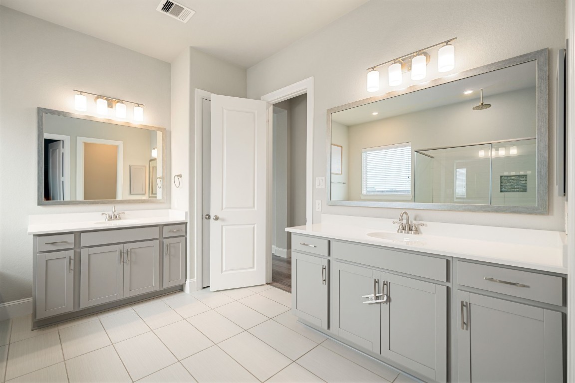 6203 Silver Lk Lane Manvel, TX 77578 - Photo 19 of 50 a bathroom with a granite countertop sink mirror and