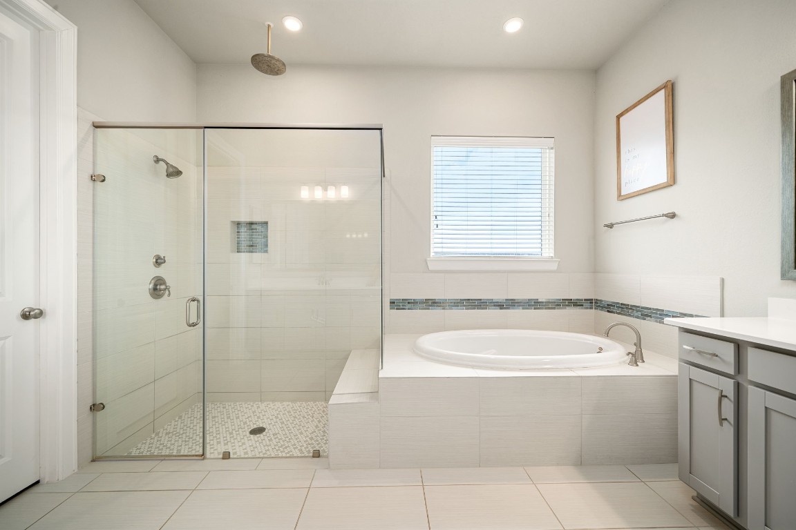 6203 Silver Lk Lane Manvel, TX 77578 - Photo 20 of 50 a bathroom with a bathtub a shower and a sink