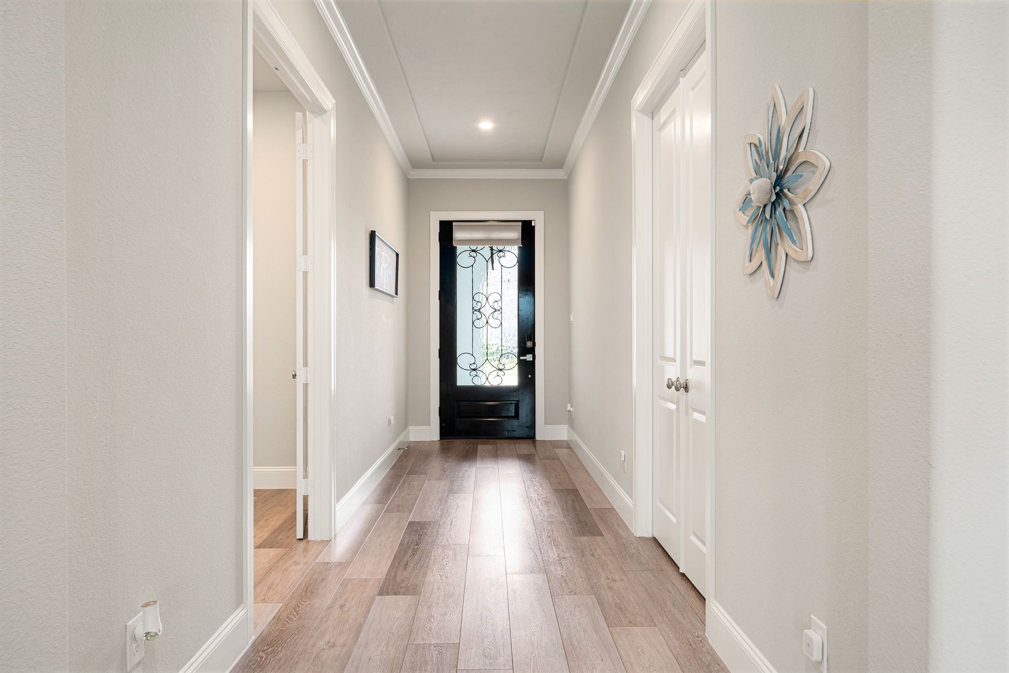 6203 Silver Lk Lane Manvel, TX 77578 - Photo 22 of 50 a view of a hallway with wooden floor and closet