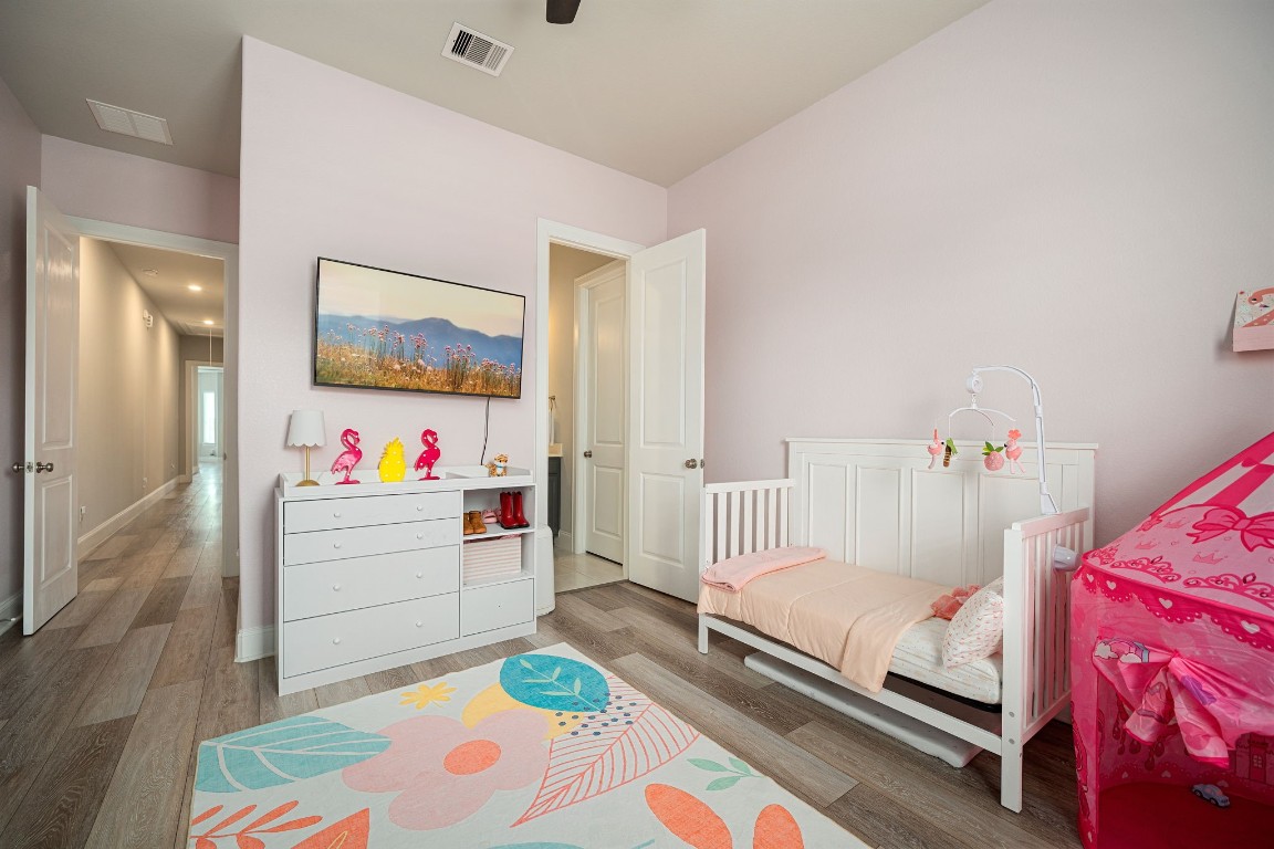 6203 Silver Lk Lane Manvel, TX 77578 - Photo 30 of 50 a room with baby crib and furniture
