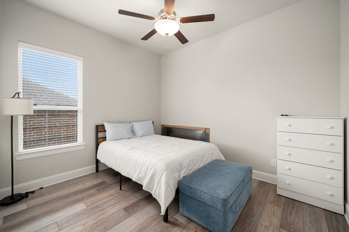 6203 Silver Lk Lane Manvel, TX 77578 - Photo 32 of 50 a bedroom with a bed and a window