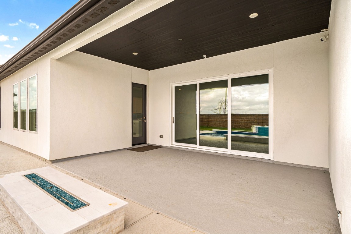 6203 Silver Lk Lane Manvel, TX 77578 - Photo 36 of 50 a view of an empty room with a sliding door