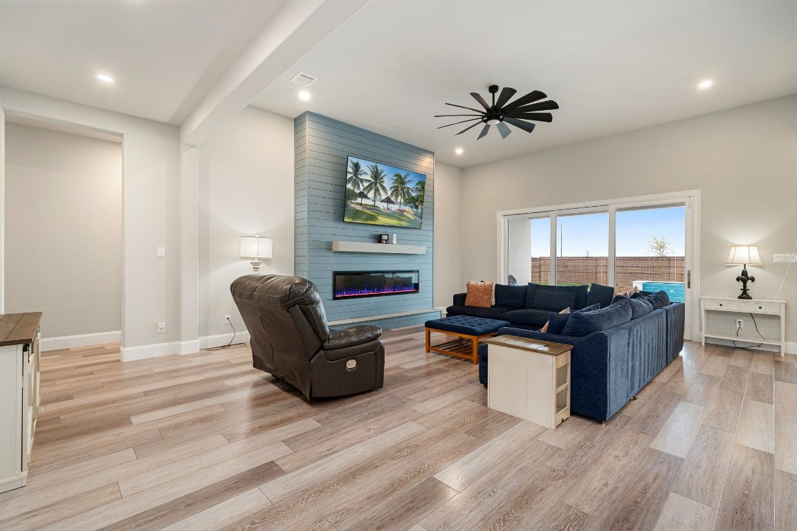 6203 Silver Lk Lane Manvel, TX 77578 - Photo 6 of 50 a living room with furniture and a wooden floor