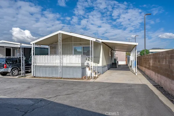 a view of a house with large outdoor space and balcony