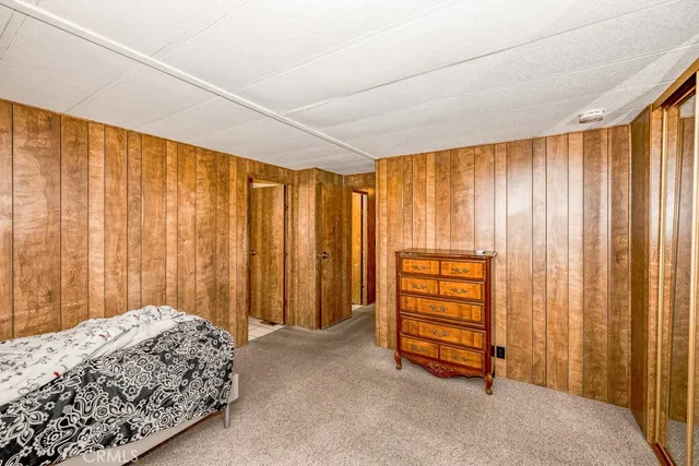 a bedroom with a bed and a curtain