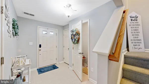 a view of a hallway with paintings on the wall