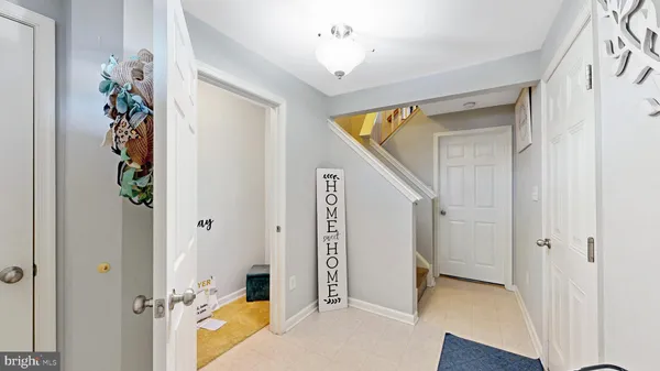a view of an entryway door and hallway
