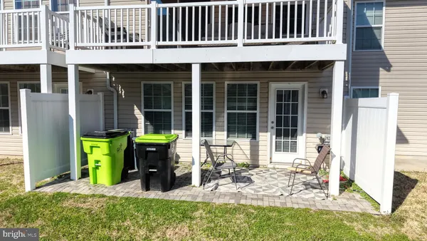 a view of a house with a patio and a garden