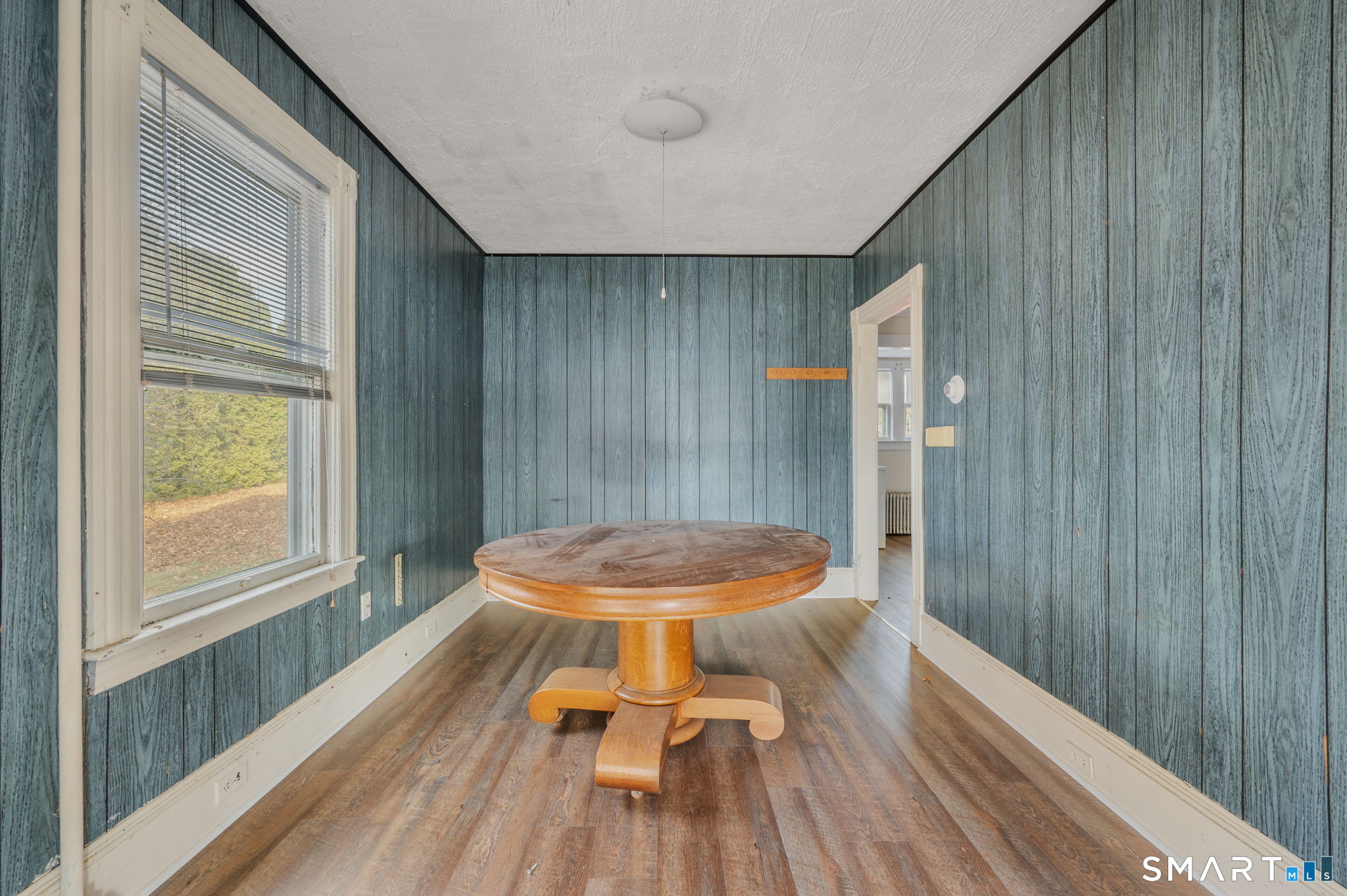 45 Dunham Street Norwich, CT 06360 - Photo 11 of 40 a view of a room with wooden floor lounge chair and windows