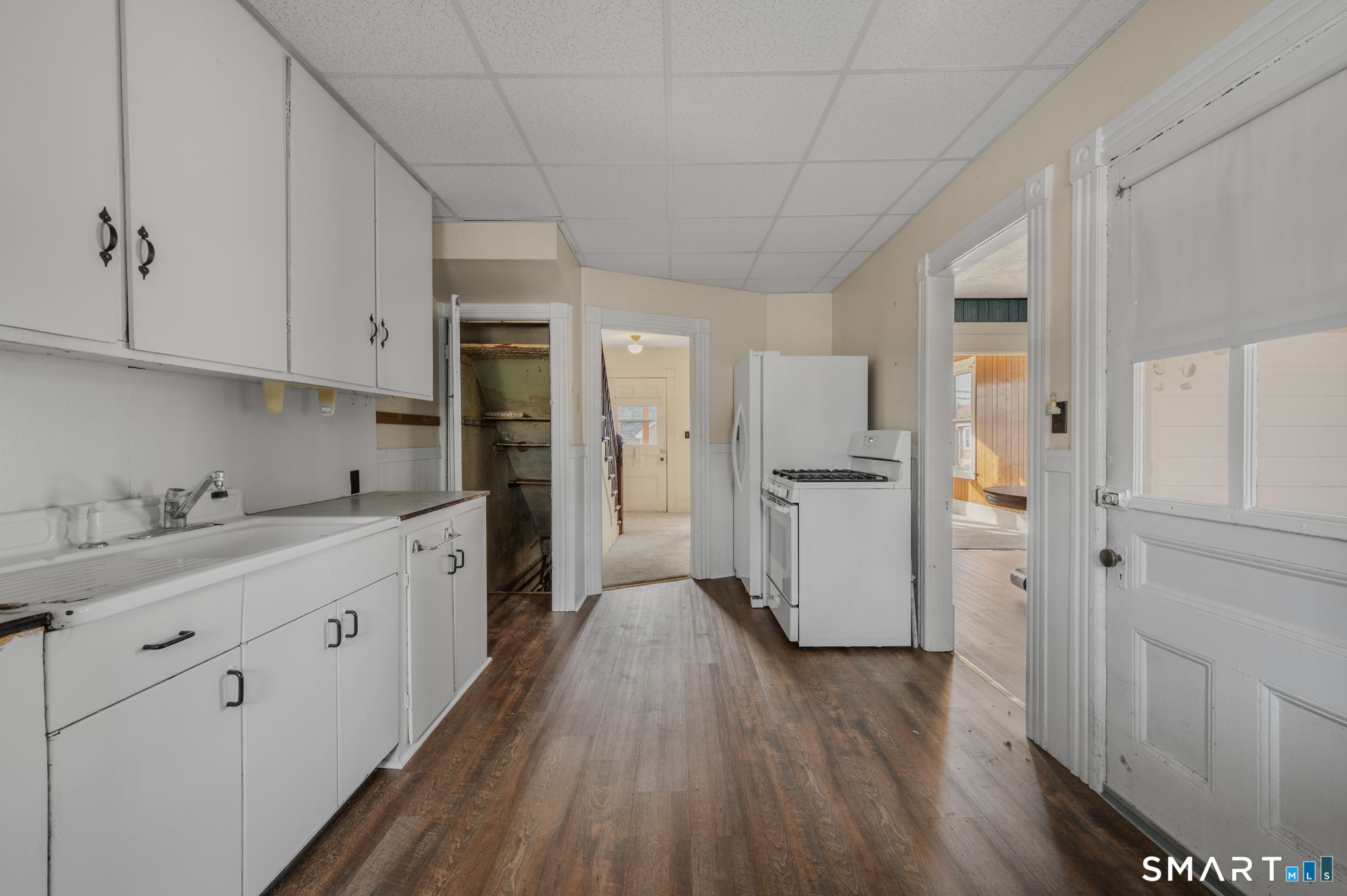 45 Dunham Street Norwich, CT 06360 - Photo 12 of 40 a kitchen with cabinets and wooden floor