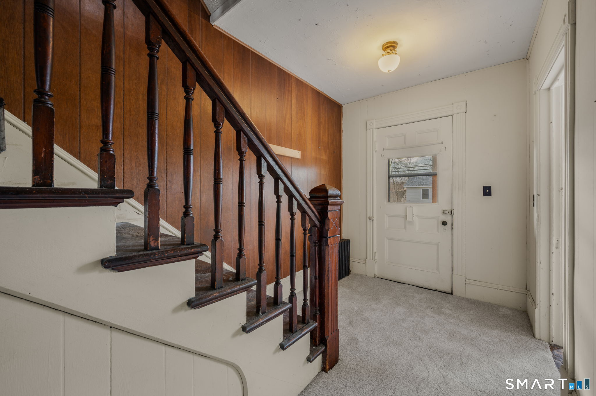 45 Dunham Street Norwich, CT 06360 - Photo 14 of 40 a view of a hallway with staircase