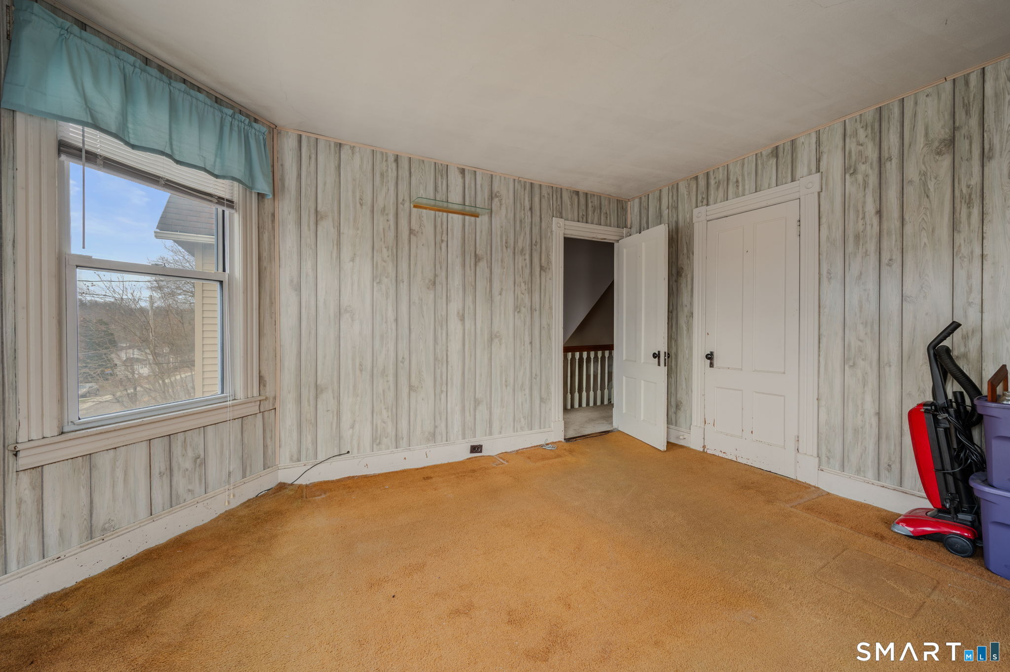 45 Dunham Street Norwich, CT 06360 - Photo 28 of 40 a view of a livingroom with a staircase