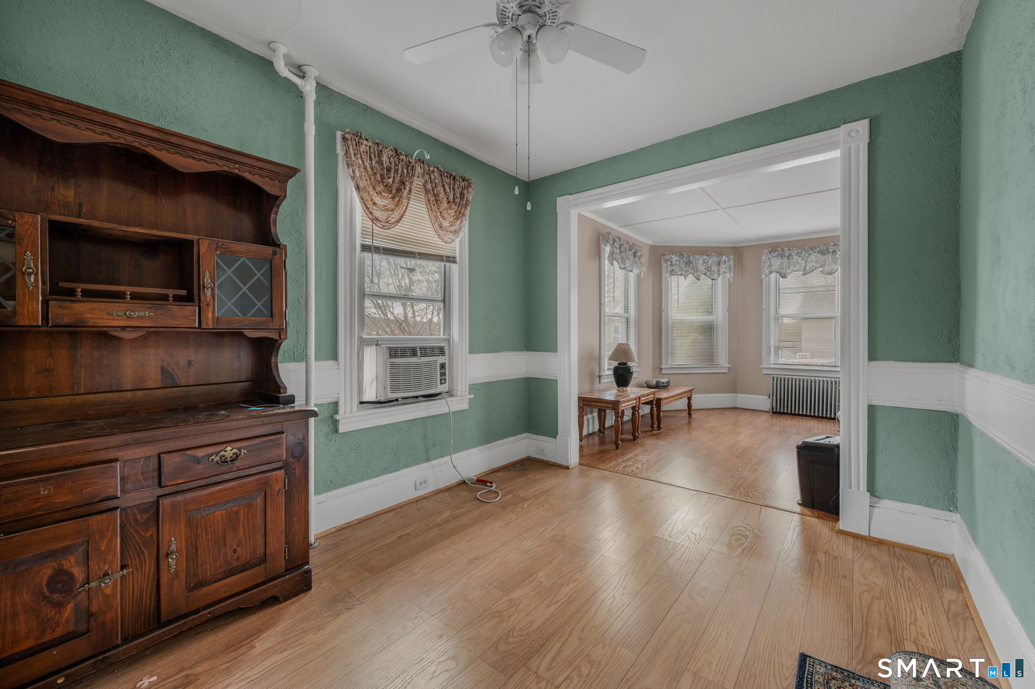 45 Dunham Street Norwich, CT 06360 - Photo 30 of 40 a living room with furniture and a flat screen tv