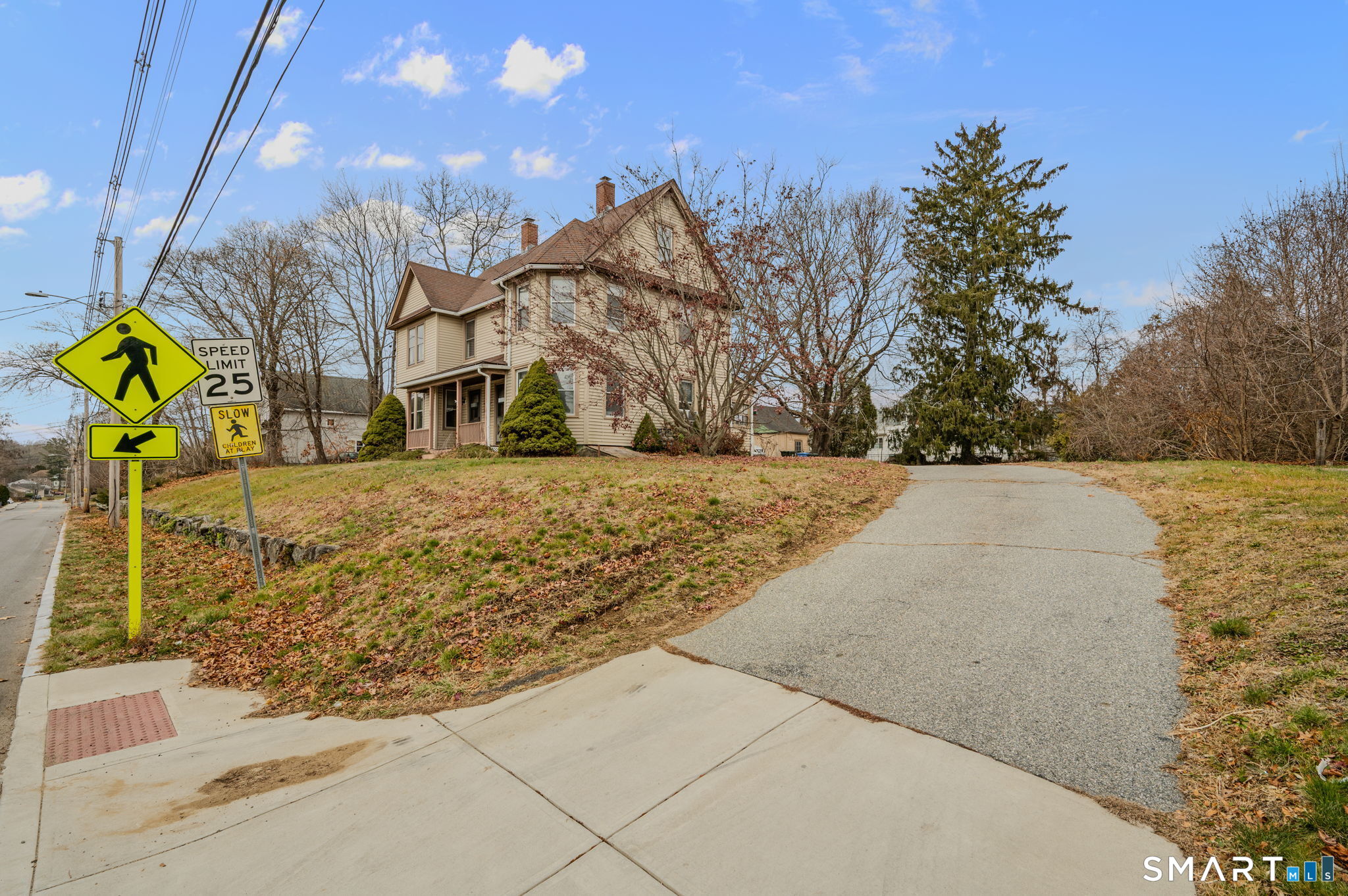 45 Dunham Street Norwich, CT 06360 - Photo 3 of 40 a view of backyard with large trees