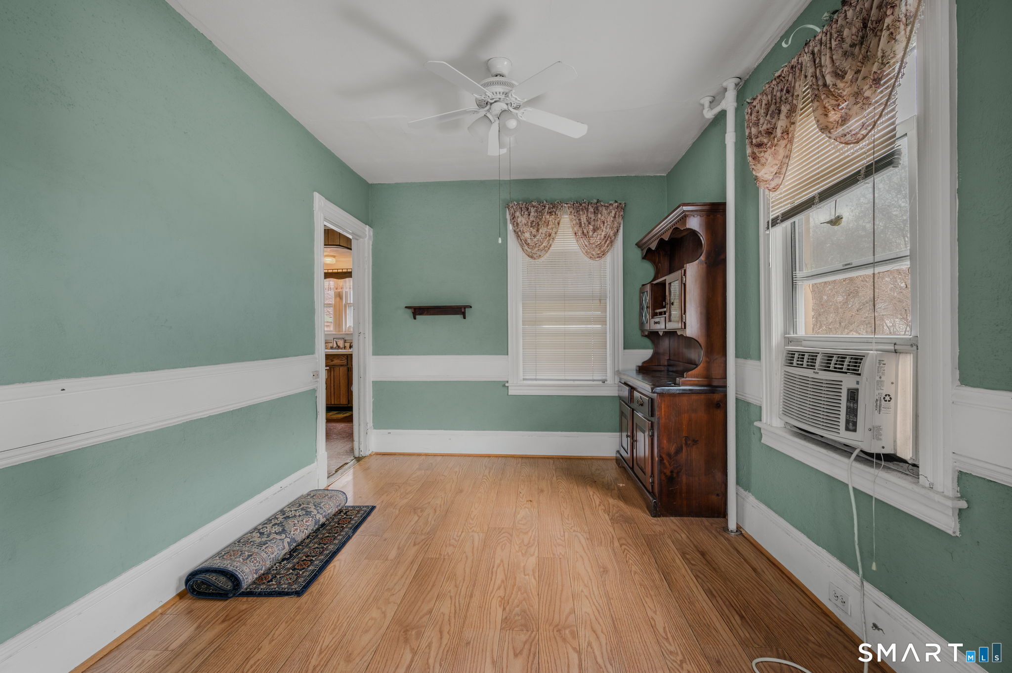 45 Dunham Street Norwich, CT 06360 - Photo 31 of 40 a view of a room with window and wooden floor
