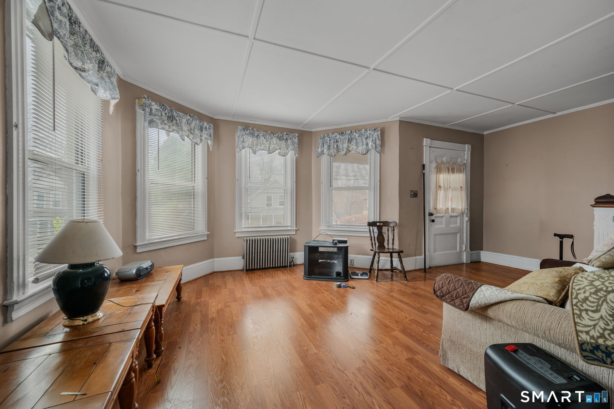 45 Dunham Street Norwich, CT 06360 - Photo 32 of 40 a living room with furniture and a large window