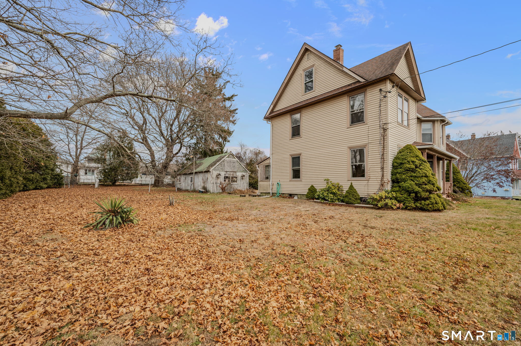 45 Dunham Street Norwich, CT 06360 - Photo 7 of 40 a view of a house with a yard covered in snow