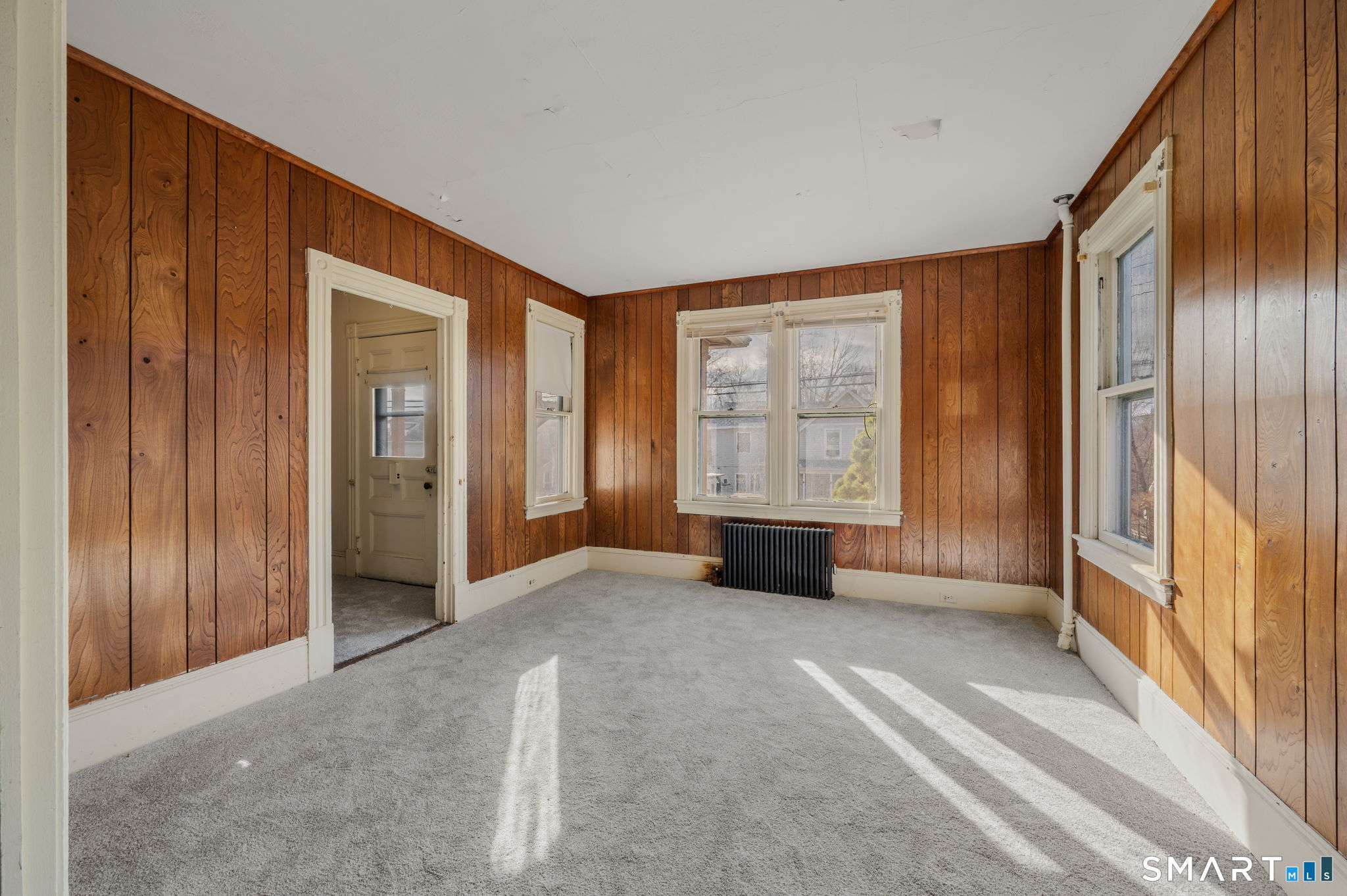 45 Dunham Street Norwich, CT 06360 - Photo 10 of 40 an empty room with windows and front door