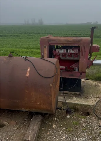 a view of a couches in the patio next to a yard