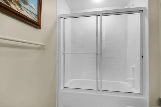 a view of a tall building and a yard