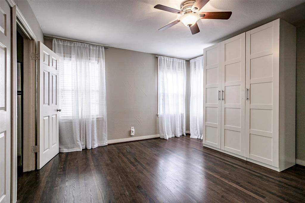 7410 Caillet Street Dallas, TX 75209 - Photo 13 of 25 a view of an empty room with wooden floor and a window