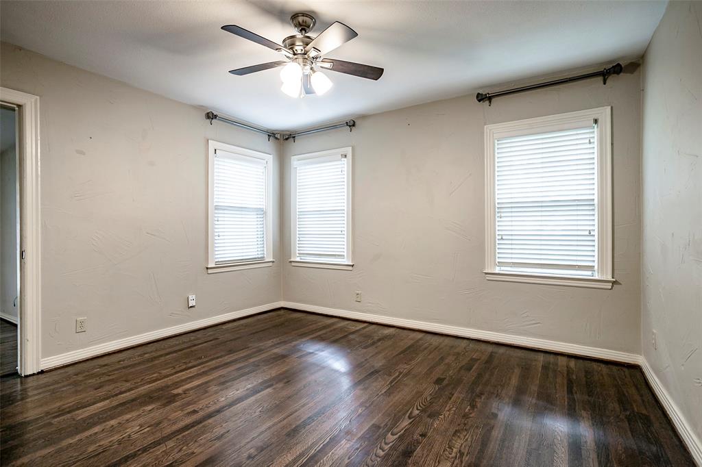 7410 Caillet Street Dallas, TX 75209 - Photo 16 of 25 a view of an empty room with wooden floor and a window