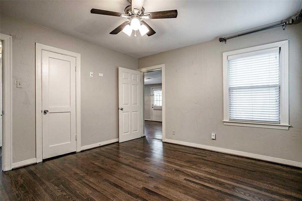 7410 Caillet Street Dallas, TX 75209 - Photo 17 of 25 a view of an empty room with wooden floor and a window
