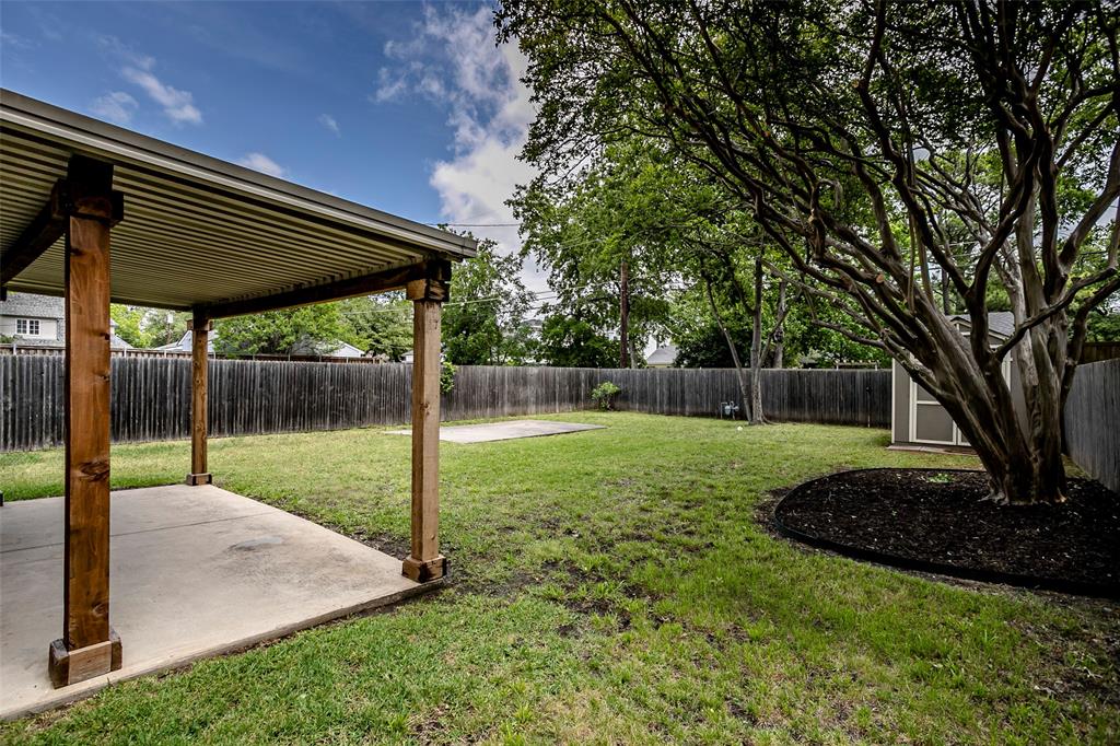 7410 Caillet Street Dallas, TX 75209 - Photo 23 of 25 a view of a backyard with a garden
