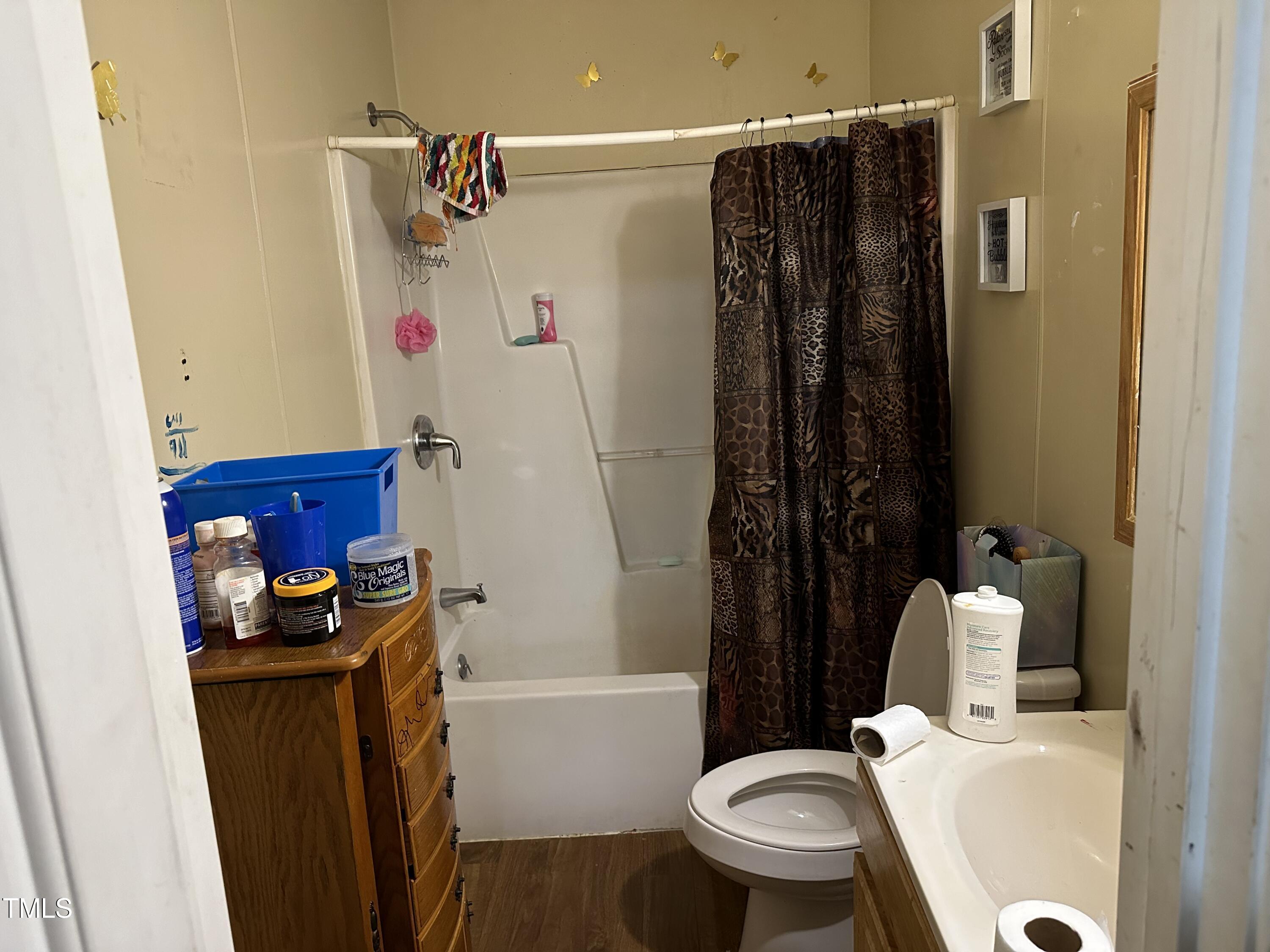 722 South Main Street Roxboro, NC 27573 - Photo 8 of 37 a bathroom with a sink toilet and shower