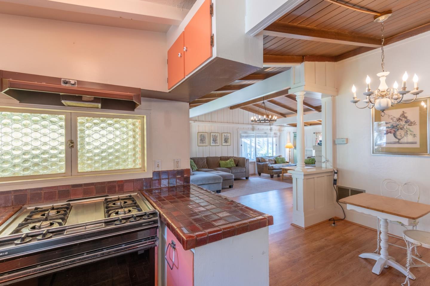 2 Mission Street Carmel, CA 93923 - Photo 11 of 31 a kitchen with a stove and a chandelier