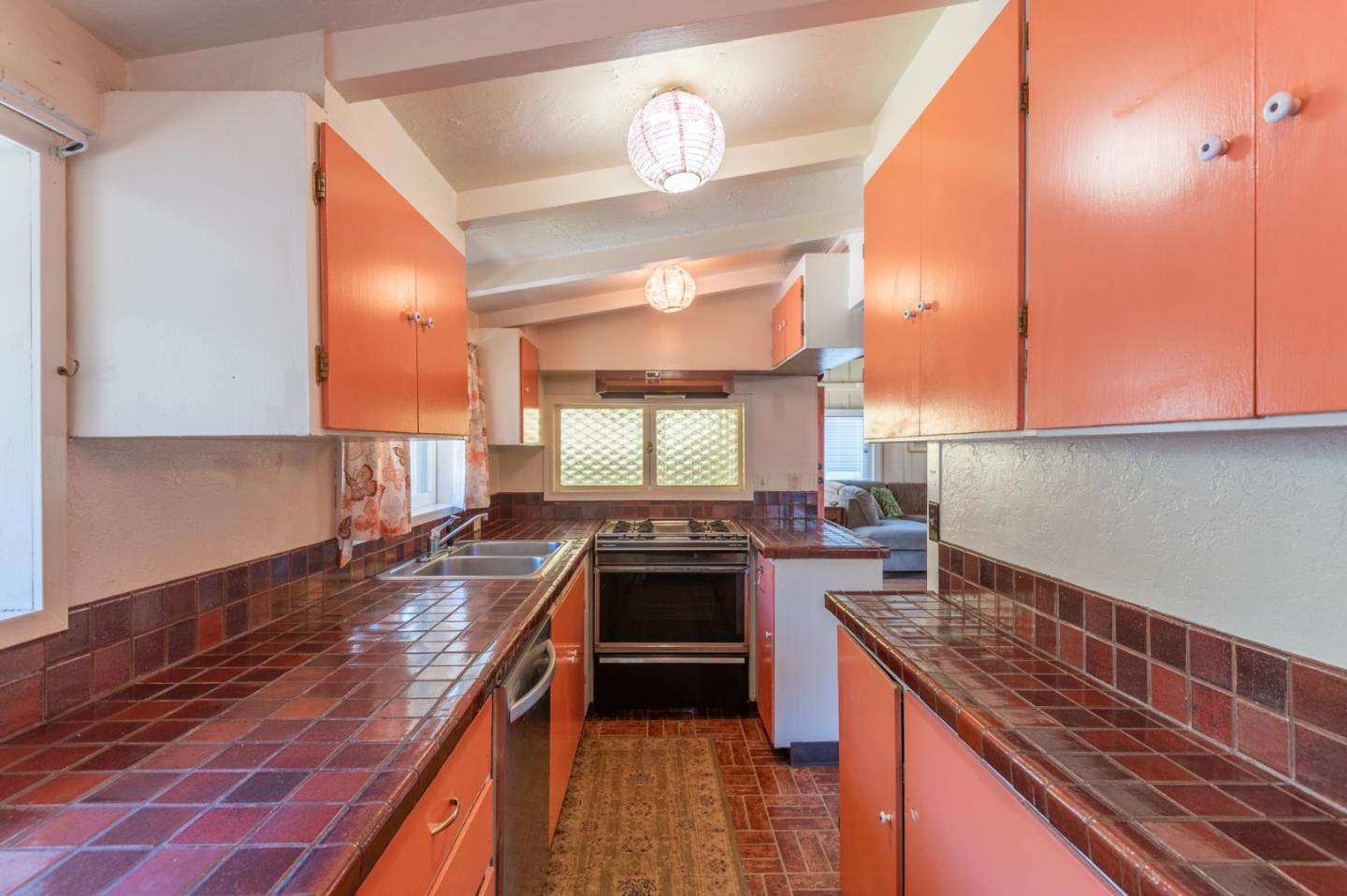 2 Mission Street Carmel, CA 93923 - Photo 12 of 31 a kitchen with stainless steel appliances granite countertop a stove a sink and a microwave