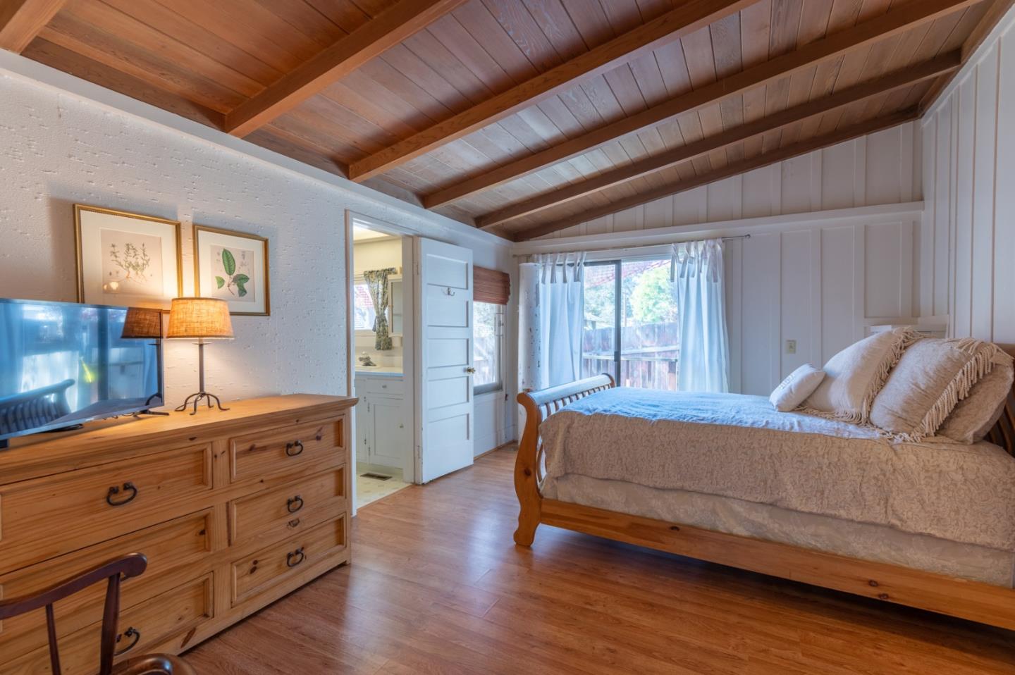 2 Mission Street Carmel, CA 93923 - Photo 13 of 31 a bed room with a bed and a dresser