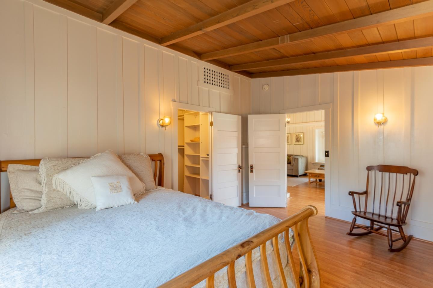 2 Mission Street Carmel, CA 93923 - Photo 14 of 31 a bedroom with a bed and chair