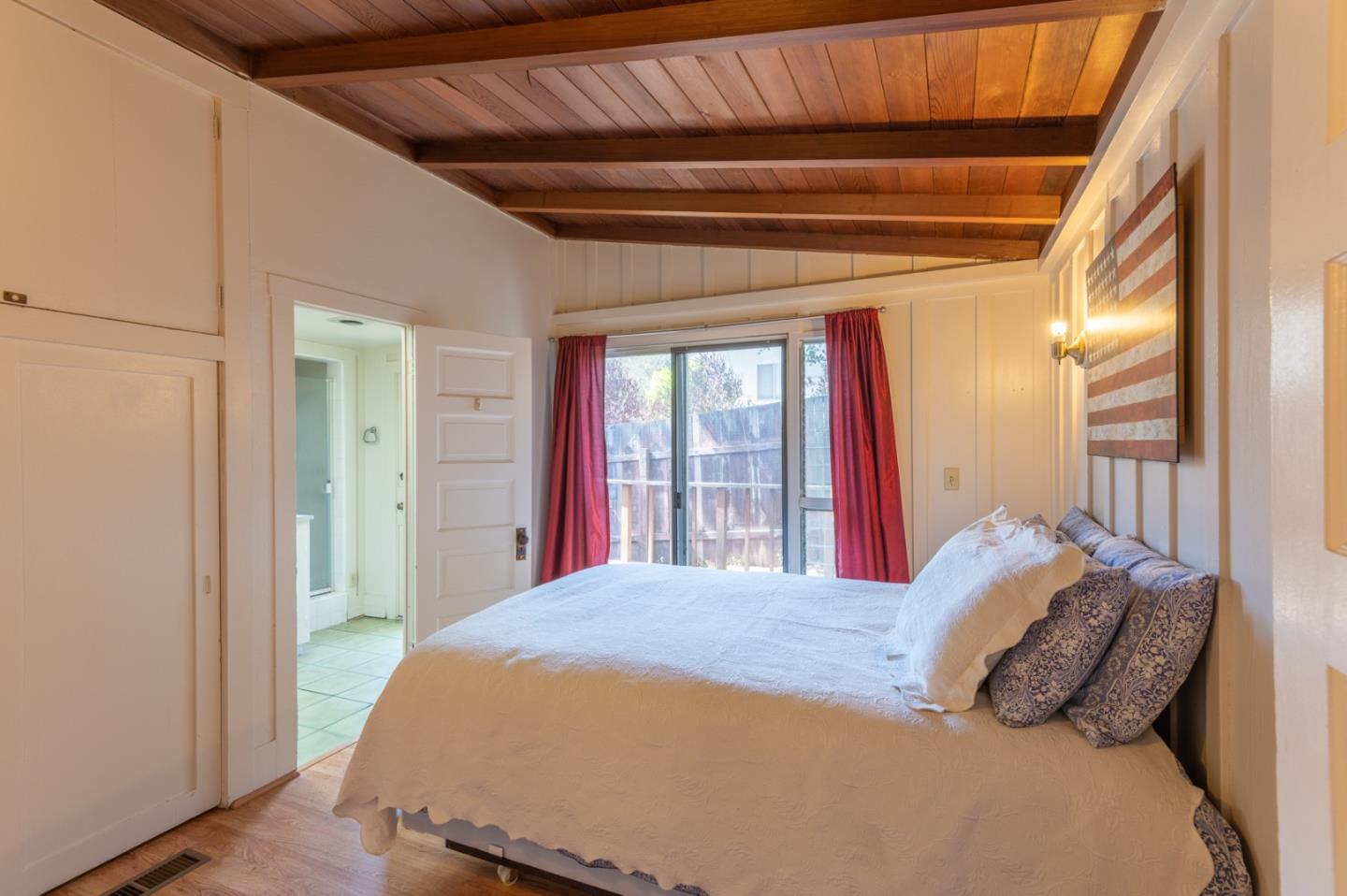 2 Mission Street Carmel, CA 93923 - Photo 18 of 31 a bedroom with a large bed and a large window