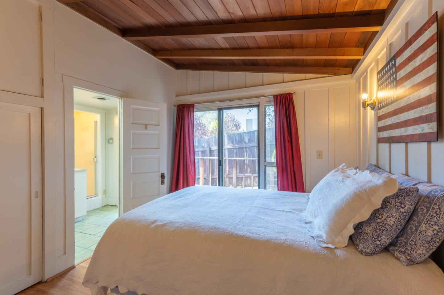 2 Mission Street Carmel, CA 93923 - Photo 20 of 31 a bed sitting in a bedroom next to a window