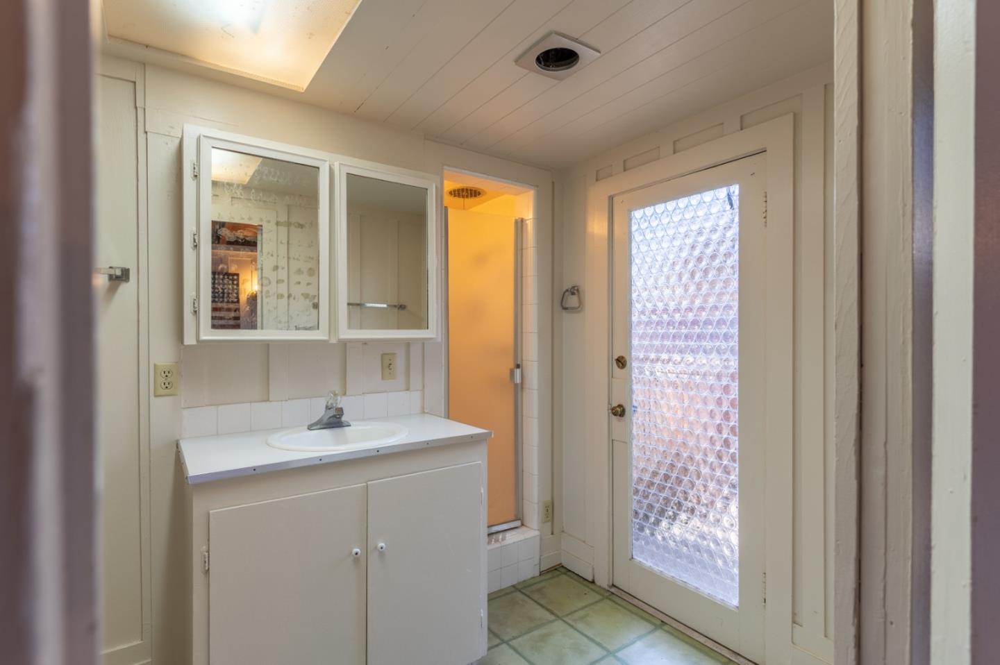 2 Mission Street Carmel, CA 93923 - Photo 22 of 31 a bathroom with a sink and a mirror