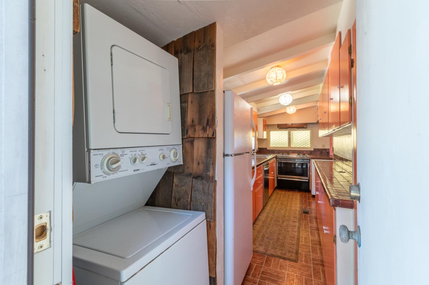 2 Mission Street Carmel, CA 93923 - Photo 23 of 31 a view of a kitchen with a refrigerator and a stove