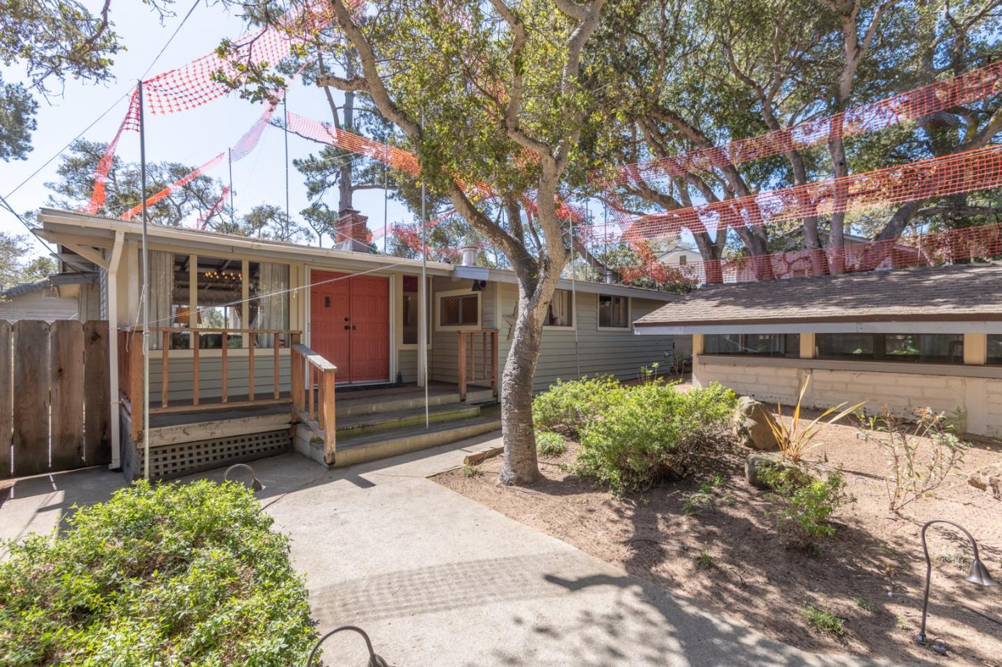 2 Mission Street Carmel, CA 93923 - Photo 24 of 31 a front view of a house with a yard