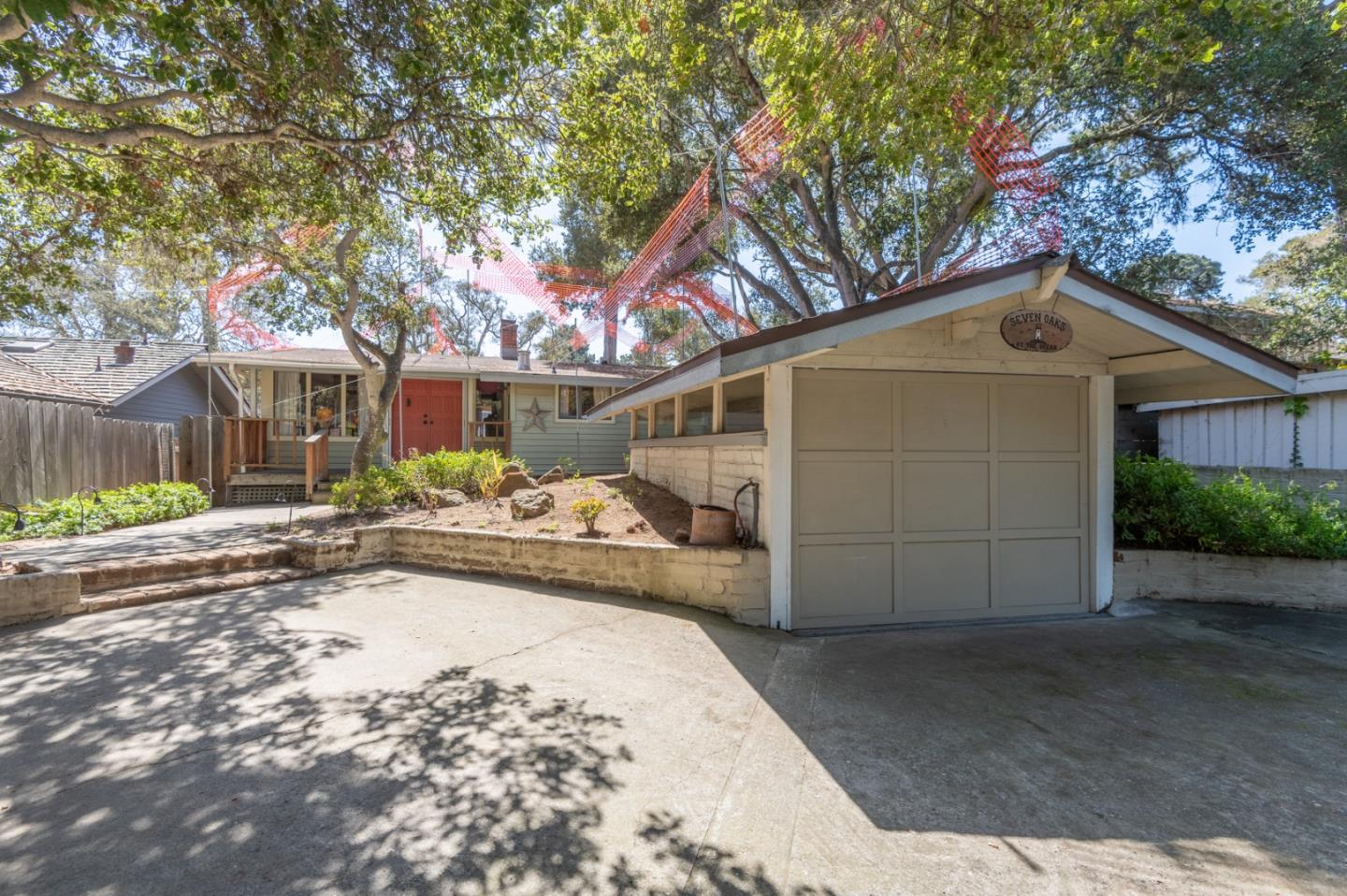 2 Mission Street Carmel, CA 93923 - Photo 25 of 31 a front view of a house with a yard and garage