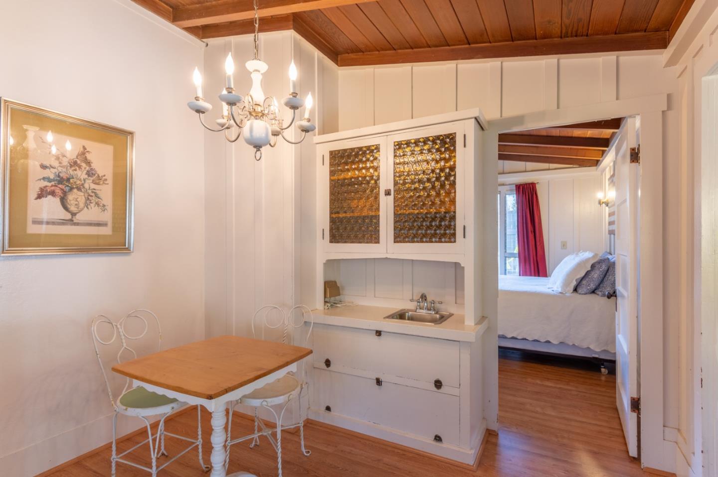 2 Mission Street Carmel, CA 93923 - Photo 8 of 31 a view of a bedroom with furniture and wooden floor