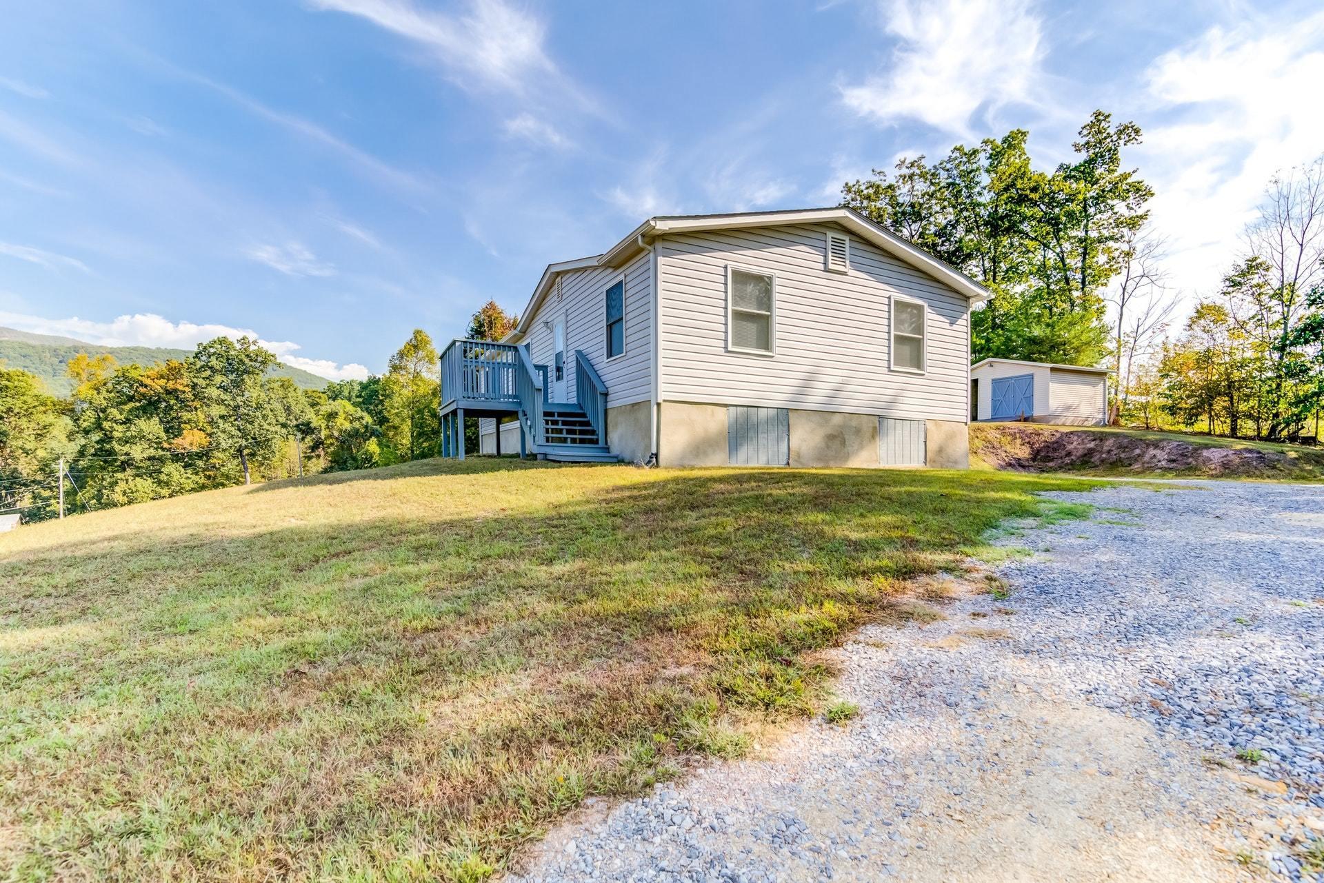 1103 Milton Road Blue Ridge, VA 24064 - Photo 2 of 29 a view of a house with a yard