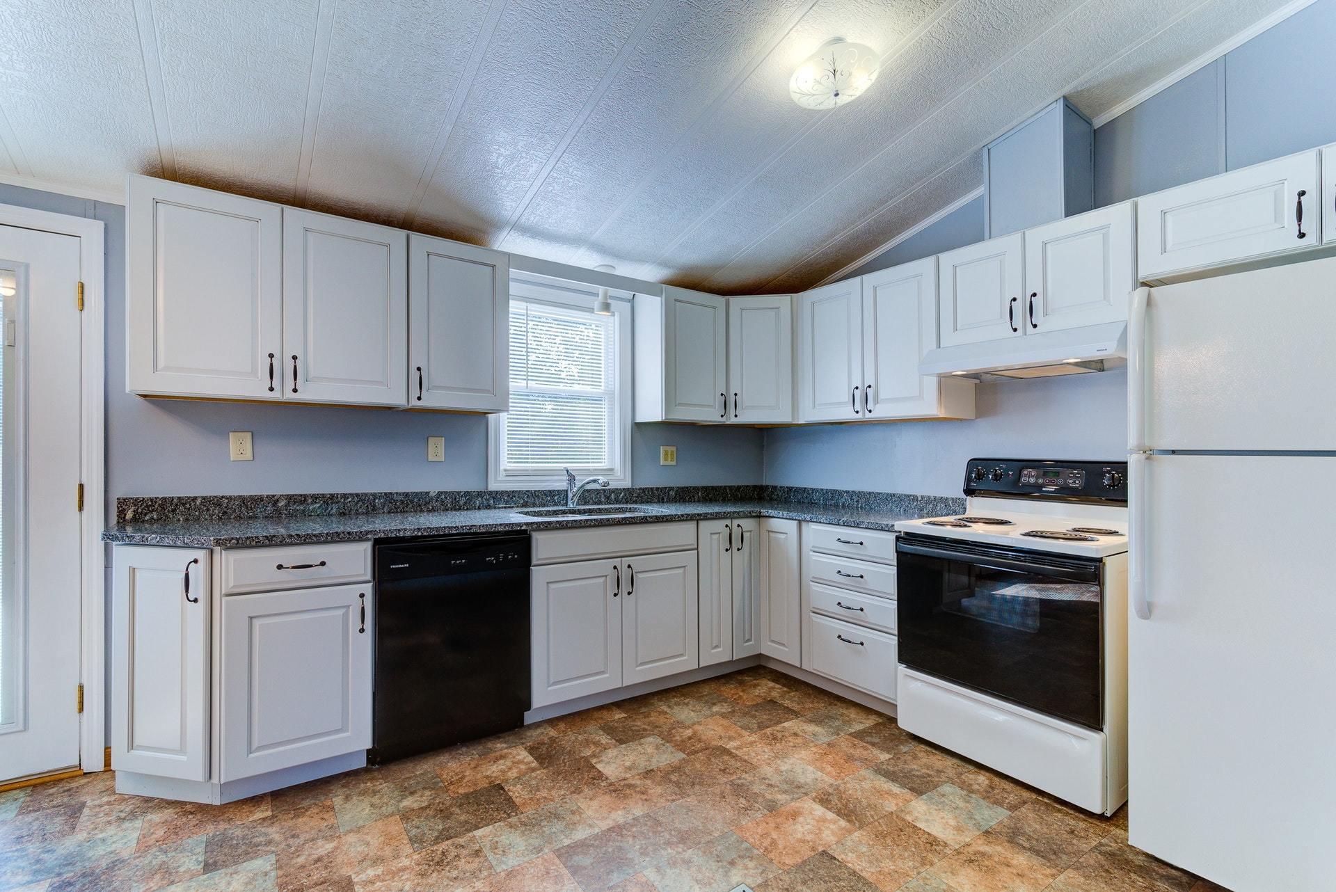 1103 Milton Road Blue Ridge, VA 24064 - Photo 11 of 29 a kitchen with granite countertop cabinets stainless steel appliances and a sink