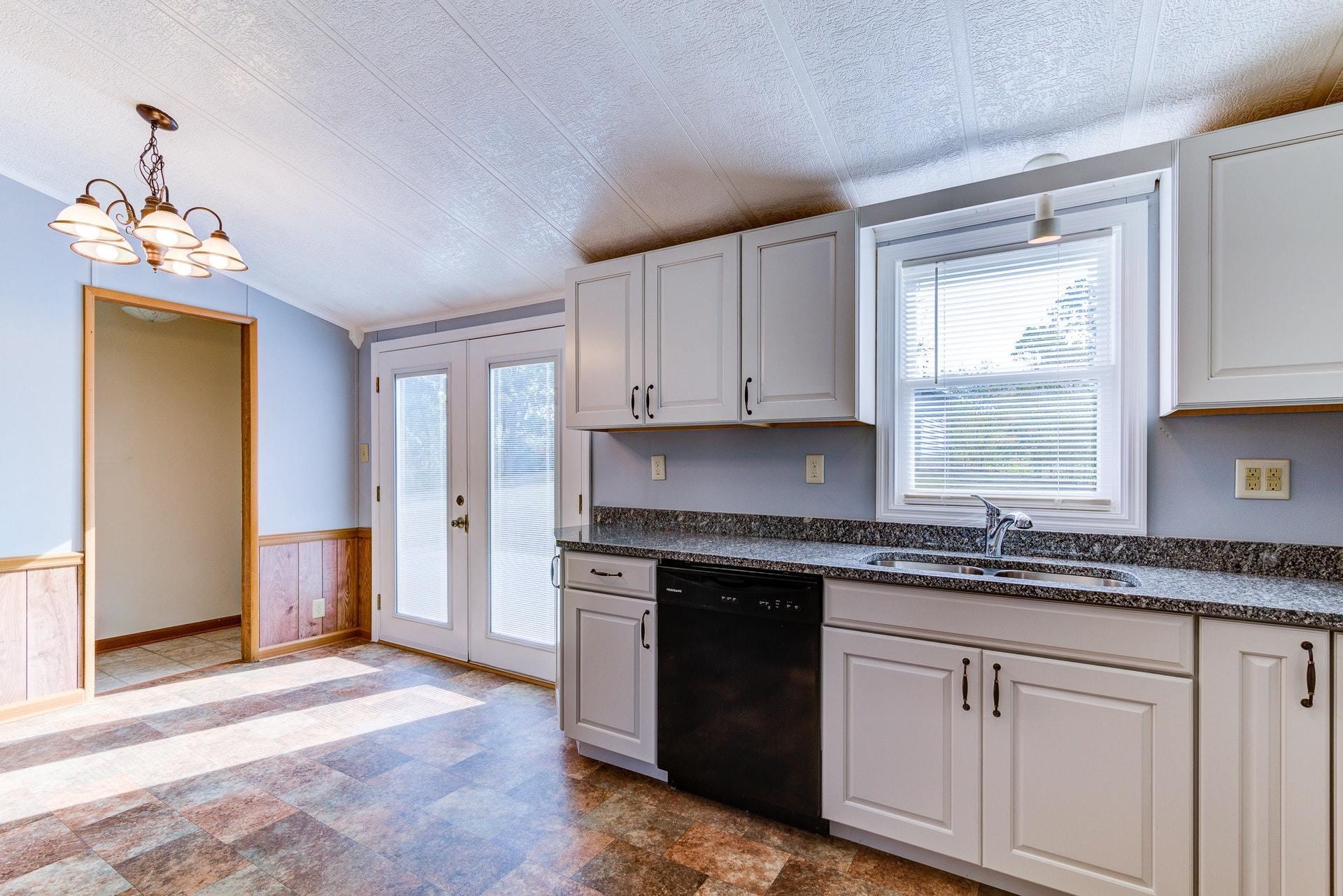 1103 Milton Road Blue Ridge, VA 24064 - Photo 12 of 29 a kitchen with a sink stove and cabinets